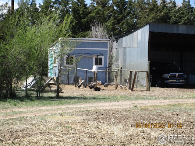 9021 County Road U.5, Weldona, CO 80653 - view of pole building featuring a carport