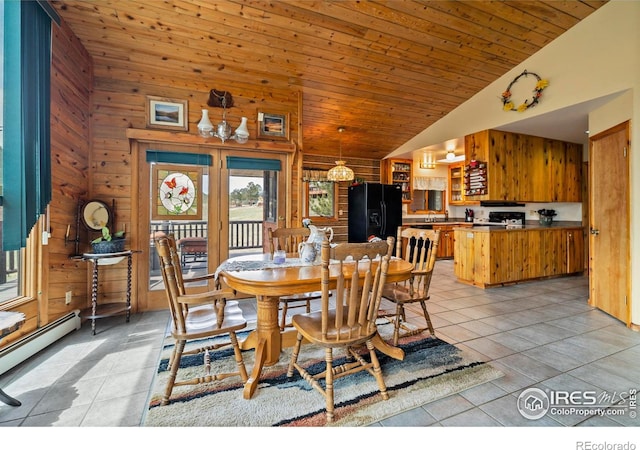 dining room featuring wood walls, a baseboard heating unit, high vaulted ceiling, light tile patterned floors, and wood ceiling