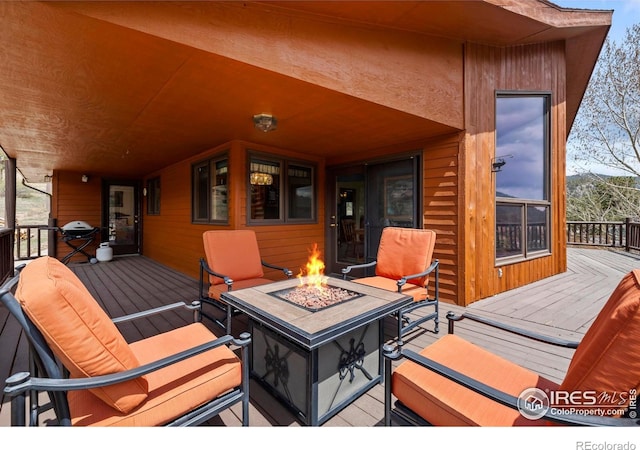 deck with a fire pit
