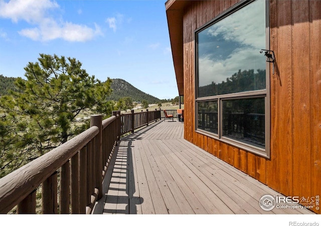 wooden terrace featuring a mountain view