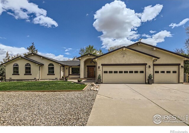 1720 Chaparro Cir, Berthoud, CO 80513 - single story home with a garage, stucco siding, a front lawn, and driveway
