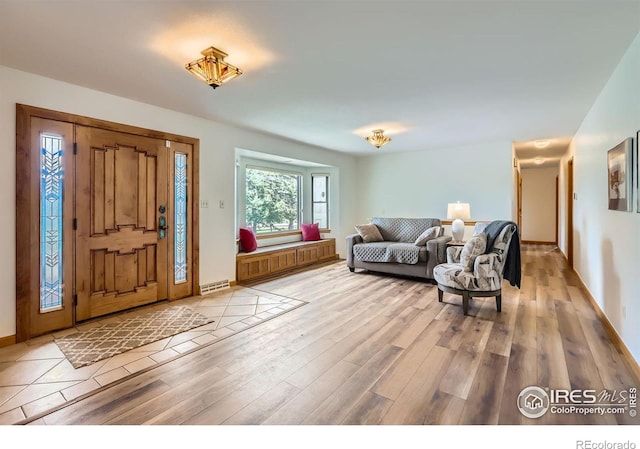 1720 Chaparro Cir, Berthoud, CO 80513 - foyer featuring light wood-style flooring and baseboards