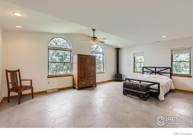 1720 Chaparro Cir, Berthoud, CO 80513 - bedroom featuring recessed lighting, baseboards, visible vents, vaulted ceiling, and a wood stove