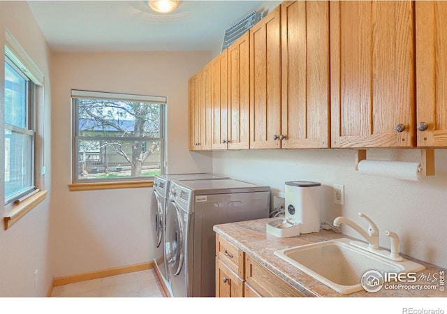 1720 Chaparro Cir, Berthoud, CO 80513 - laundry room with baseboards, a sink, washer and dryer, and cabinet space