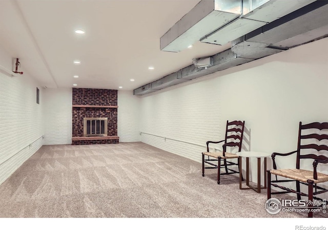 1720 Chaparro Cir, Berthoud, CO 80513 - sitting room with brick wall, a brick fireplace, carpet floors, and recessed lighting