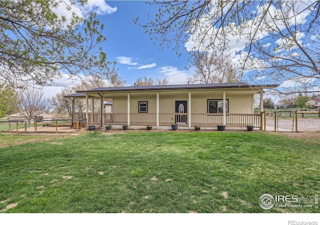 1720 Chaparro Cir, Berthoud, CO 80513 - view of front of property with a front lawn, covered porch, and fence
