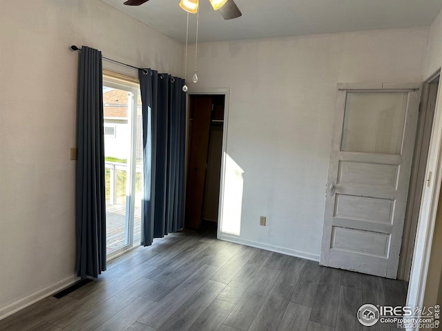 109 E 5th St, Julesburg, CO 80737 - interior space with ceiling fan, baseboards, and dark wood-type flooring
