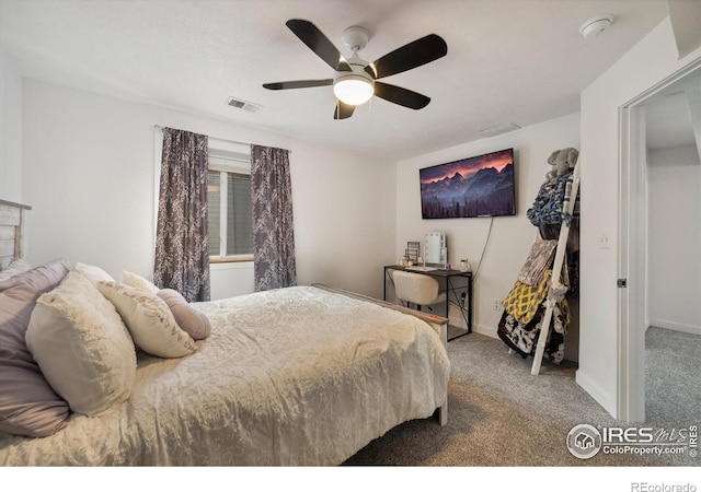 carpeted bedroom featuring visible vents, baseboards, and a ceiling fan