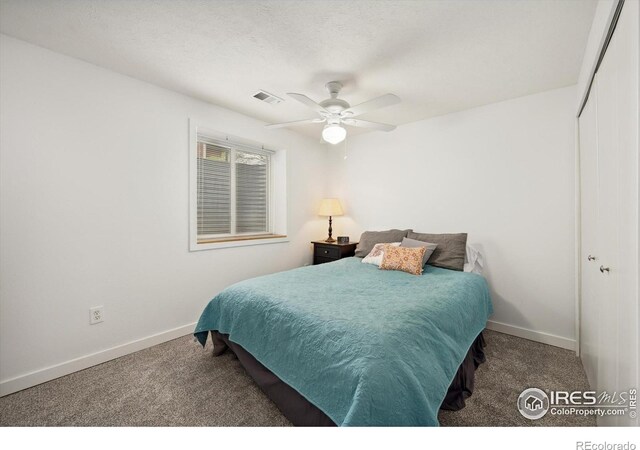 bedroom with carpet flooring, a closet, baseboards, and visible vents