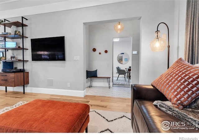 interior space featuring wood finished floors and baseboards