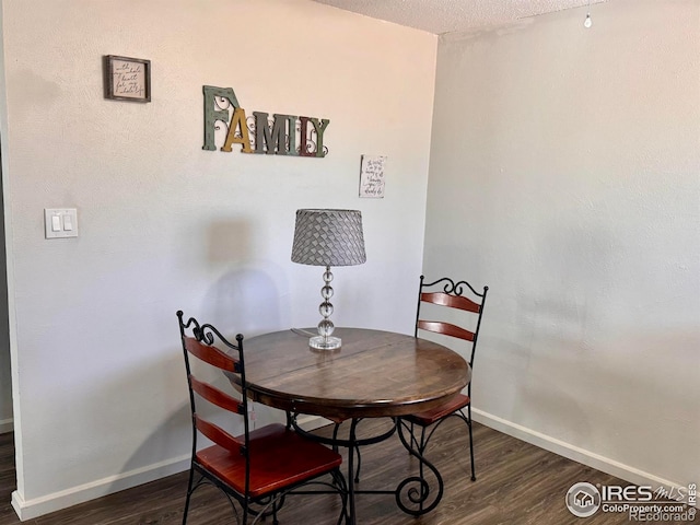 618 Melody Ln, Sterling, CO 80751 - dining room featuring wood finished floors and baseboards