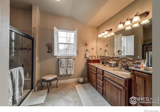 1379 Charles Dr Unit 4, Longmont, CO 80503 - full bath featuring a shower stall, tile patterned floors, double vanity, and a sink