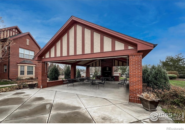 1379 Charles Dr Unit 4, Longmont, CO 80503 - view of patio featuring a gazebo and outdoor dining space