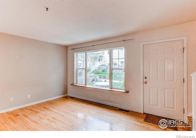 3840 Colorado Ave Unit D, Boulder, CO 80303 - foyer featuring visible vents, baseboards, and hardwood / wood-style flooring