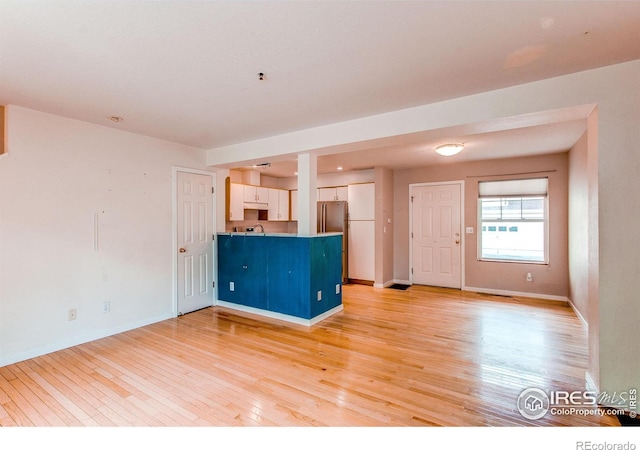 3840 Colorado Ave Unit D, Boulder, CO 80303 - empty room featuring baseboards and light wood-style flooring