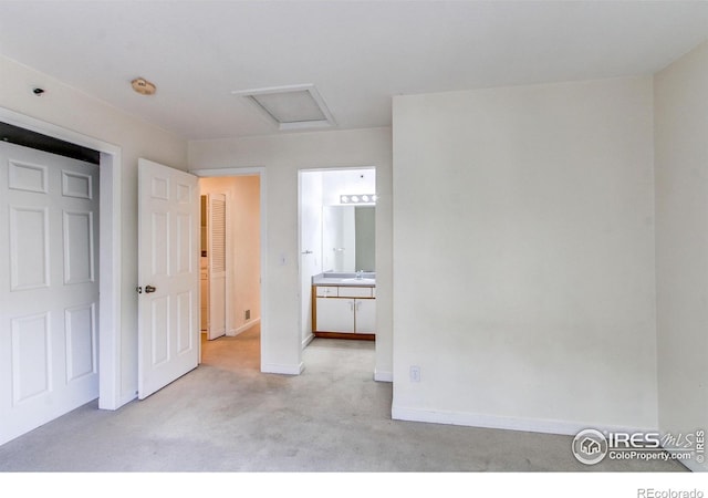 3840 Colorado Ave Unit D, Boulder, CO 80303 - unfurnished bedroom featuring baseboards, ensuite bathroom, attic access, and carpet floors
