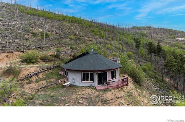 aerial view featuring a view of trees