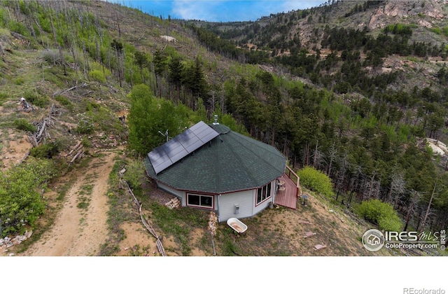 birds eye view of property featuring a mountain view