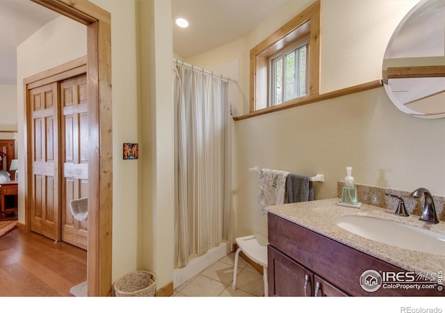 bathroom featuring vanity and a shower with shower curtain