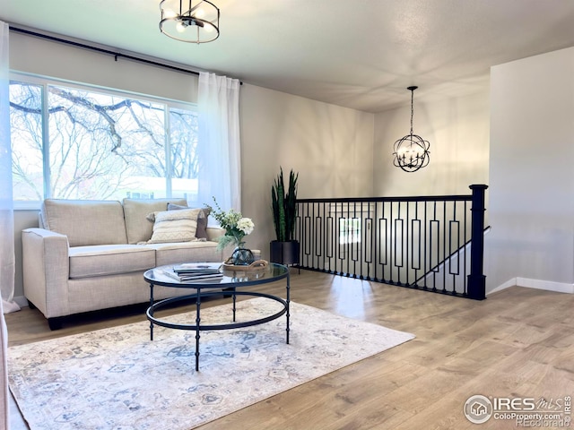 237 Clover Ln, Fort Collins, CO 80521 - living room featuring a chandelier and wood finished floors