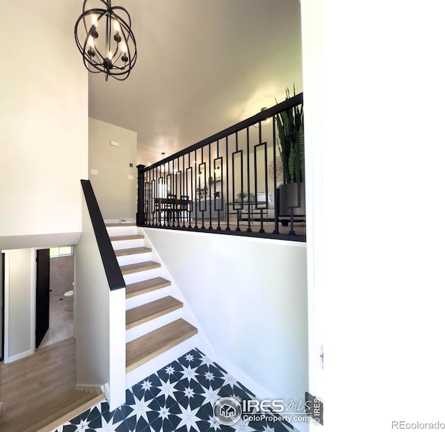 237 Clover Ln, Fort Collins, CO 80521 - staircase with a chandelier