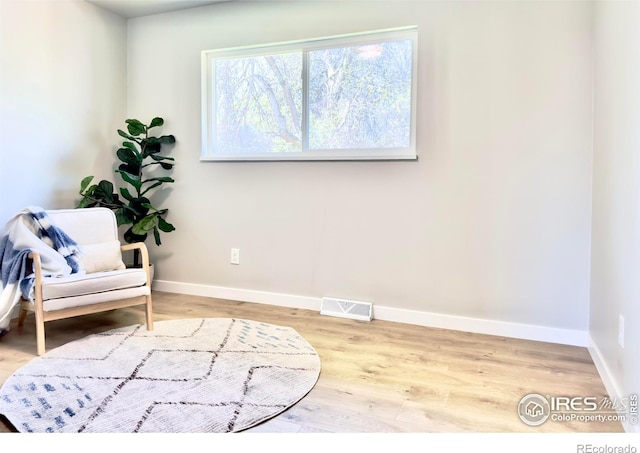 237 Clover Ln, Fort Collins, CO 80521 - sitting room featuring baseboards and wood finished floors