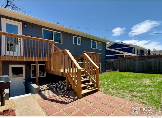 237 Clover Ln, Fort Collins, CO 80521 - rear view of house with a fenced backyard, a wooden deck, and stairs