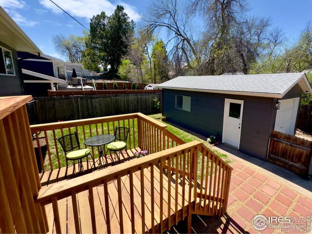 237 Clover Ln, Fort Collins, CO 80521 - wooden terrace with a fenced backyard and an outdoor structure