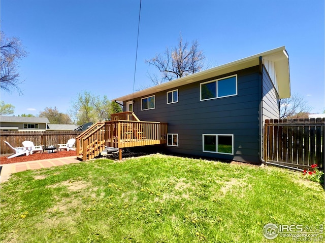 237 Clover Ln, Fort Collins, CO 80521 - back of property with a fenced backyard and a deck