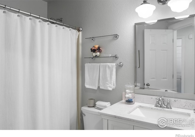 112 Cobble Dr, Windsor, CO 80550 - bathroom featuring toilet and vanity