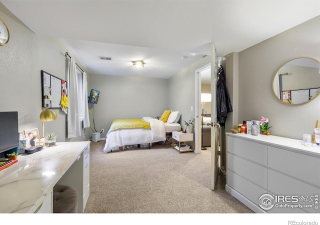 112 Cobble Dr, Windsor, CO 80550 - bedroom featuring light carpet and visible vents