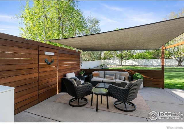 112 Cobble Dr, Windsor, CO 80550 - view of patio featuring an outdoor hangout area and a fenced backyard