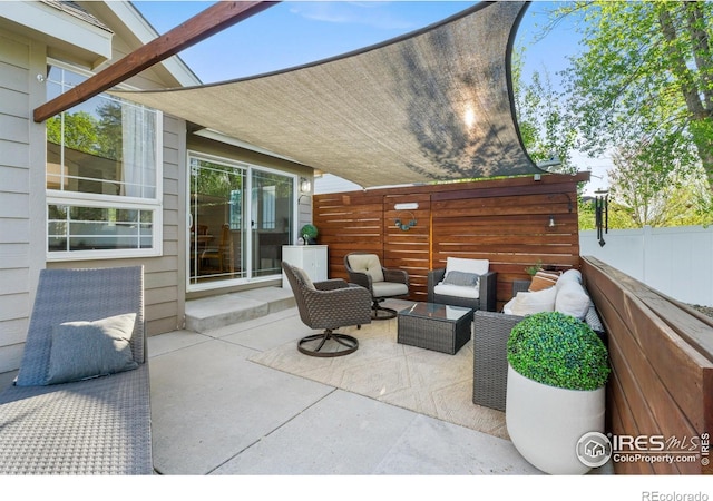 112 Cobble Dr, Windsor, CO 80550 - view of patio / terrace with outdoor lounge area and fence