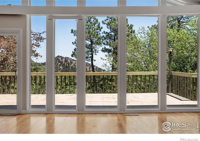 1629 Timber Ln, Boulder, CO 80304 - doorway with healthy amount of natural light, wood finished floors, and a mountain view