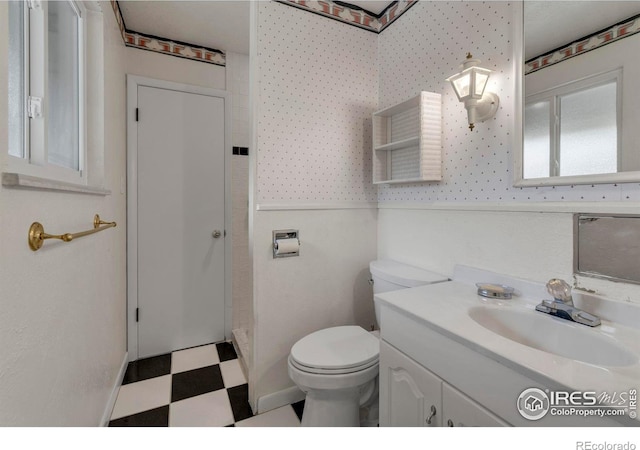 1629 Timber Ln, Boulder, CO 80304 - full bathroom featuring tile patterned floors, vanity, toilet, and baseboards