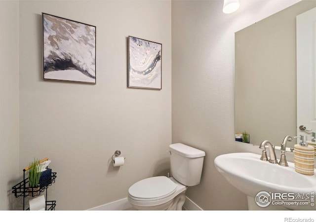 1481 Harebell St, Berthoud, CO 80513 - bathroom with a sink, toilet, and baseboards