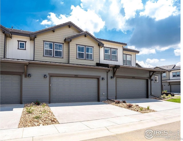 1481 Harebell St, Berthoud, CO 80513 - townhome / multi-family property featuring concrete driveway, an attached garage, and board and batten siding