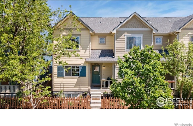 1278 Hummingbird Cir Unit D, Longmont, CO 80501 - view of front of property featuring roof with shingles and fence