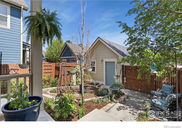 1278 Hummingbird Cir Unit D, Longmont, CO 80501 - bungalow-style house with roof with shingles, fence, and a gate