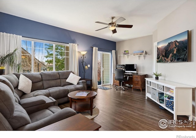 1278 Hummingbird Cir Unit D, Longmont, CO 80501 - living room featuring dark wood-style flooring and ceiling fan