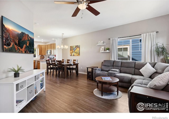 1278 Hummingbird Cir Unit D, Longmont, CO 80501 - living area with ceiling fan with notable chandelier, dark wood-type flooring, baseboards, and recessed lighting
