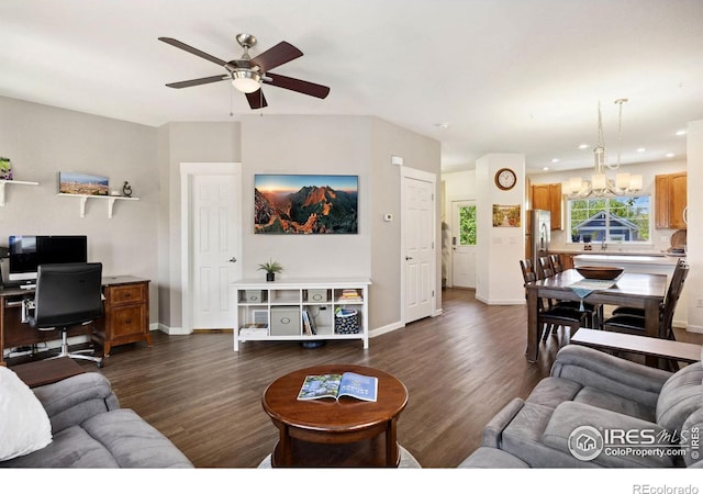 1278 Hummingbird Cir Unit D, Longmont, CO 80501 - living room featuring ceiling fan with notable chandelier, dark wood-type flooring, baseboards, and recessed lighting
