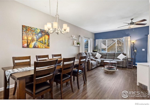 1278 Hummingbird Cir Unit D, Longmont, CO 80501 - dining area with ceiling fan with notable chandelier, baseboards, and dark wood finished floors