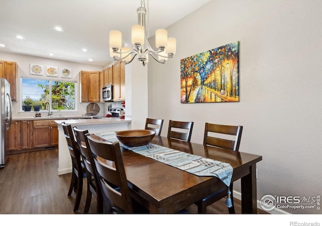 1278 Hummingbird Cir Unit D, Longmont, CO 80501 - dining space with an inviting chandelier, dark wood-style flooring, and recessed lighting