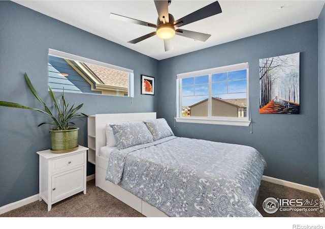 1278 Hummingbird Cir Unit D, Longmont, CO 80501 - carpeted bedroom featuring baseboards and a ceiling fan