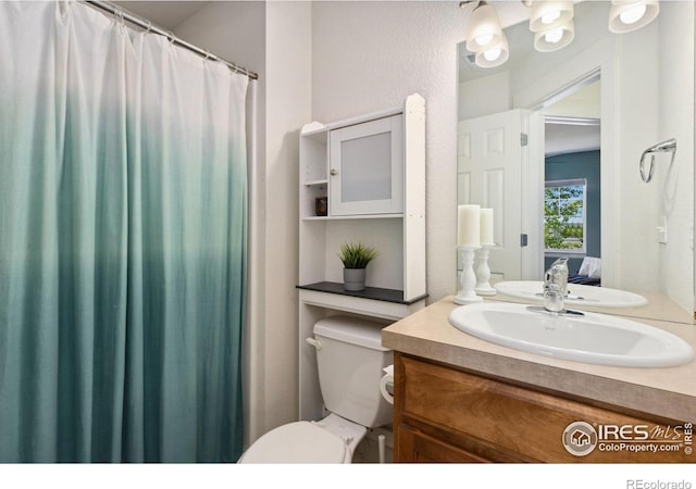 1278 Hummingbird Cir Unit D, Longmont, CO 80501 - bathroom with vanity and toilet