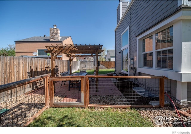 view of yard featuring a pergola and a fenced backyard