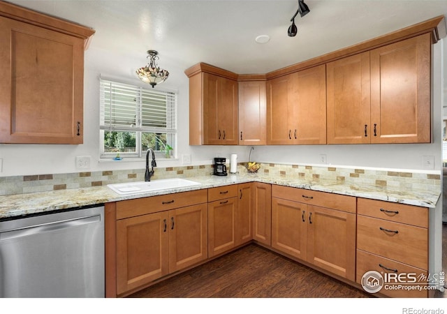 kitchen featuring stainless steel dishwasher, brown cabinetry, dark wood-style flooring, light stone counters, and a sink