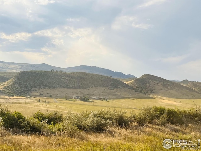 view of mountain feature with a rural view
