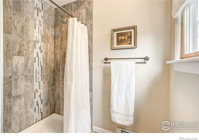 bathroom with a tile shower
